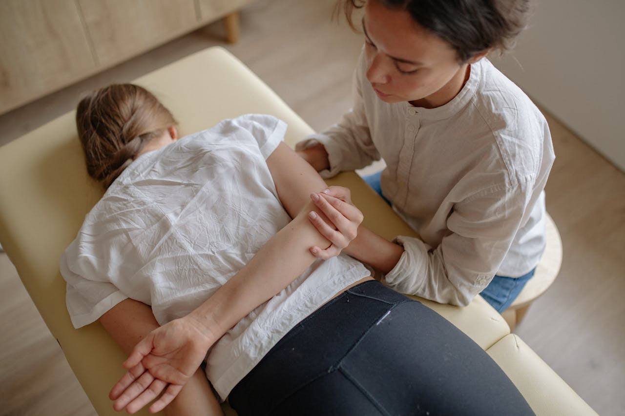 A woman receiving chiropractic treatment on a massage table for relaxation and health.